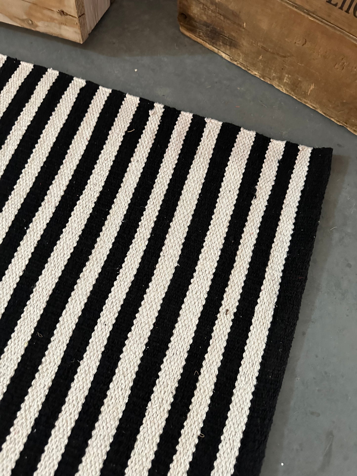 Black and White Striped Layering Rug